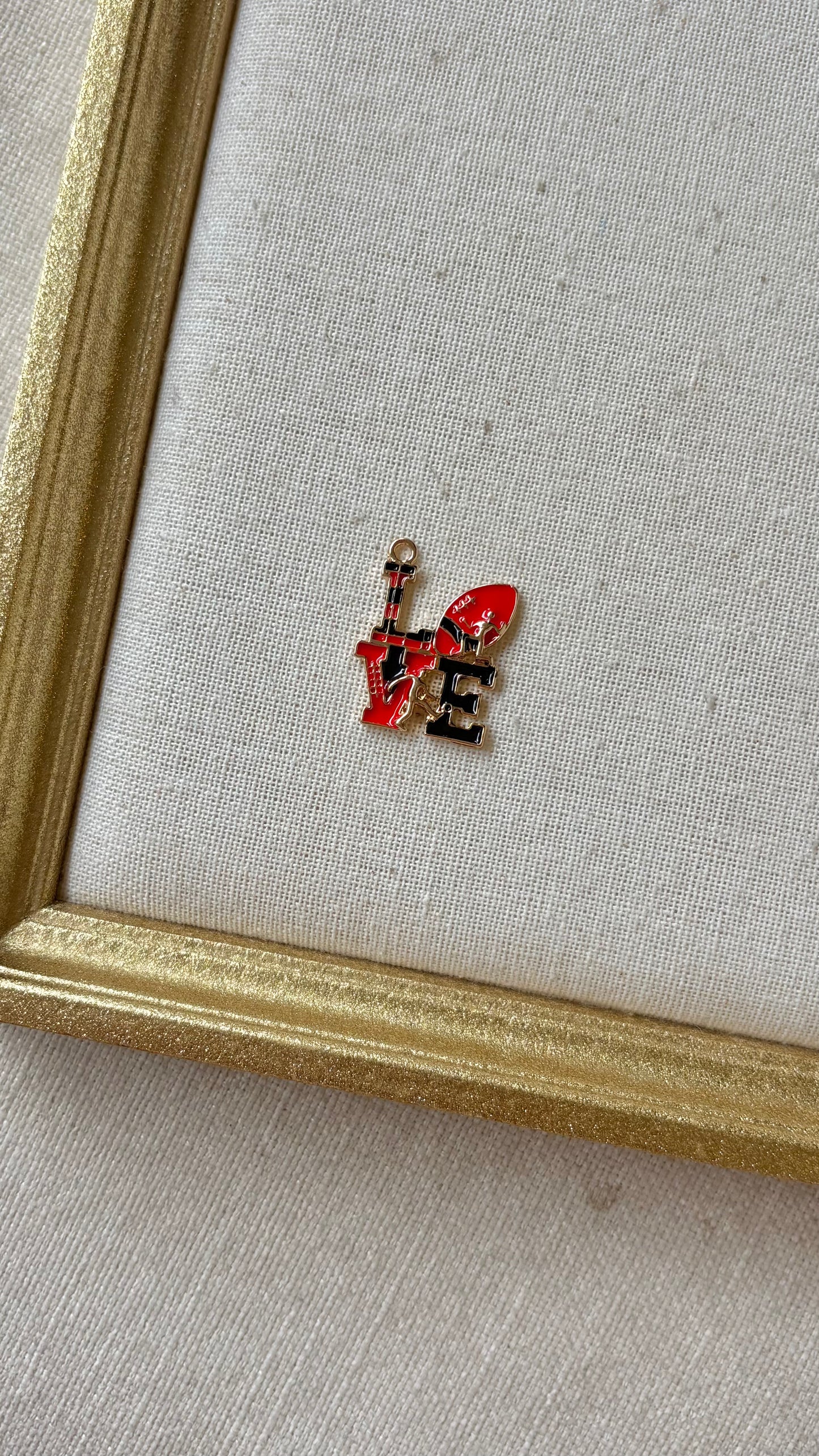 Red and Black Assorted Football Charms